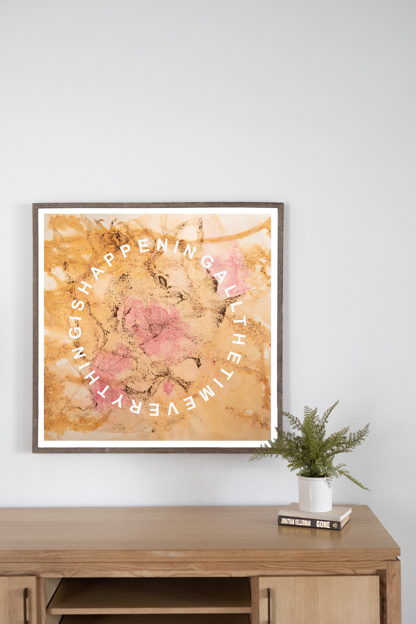 Cave Medicine Square Art Print entitled 'Everything' with the words "Everything Is Happening all the time" written in a circular fashion. Predominantly orange in colour.